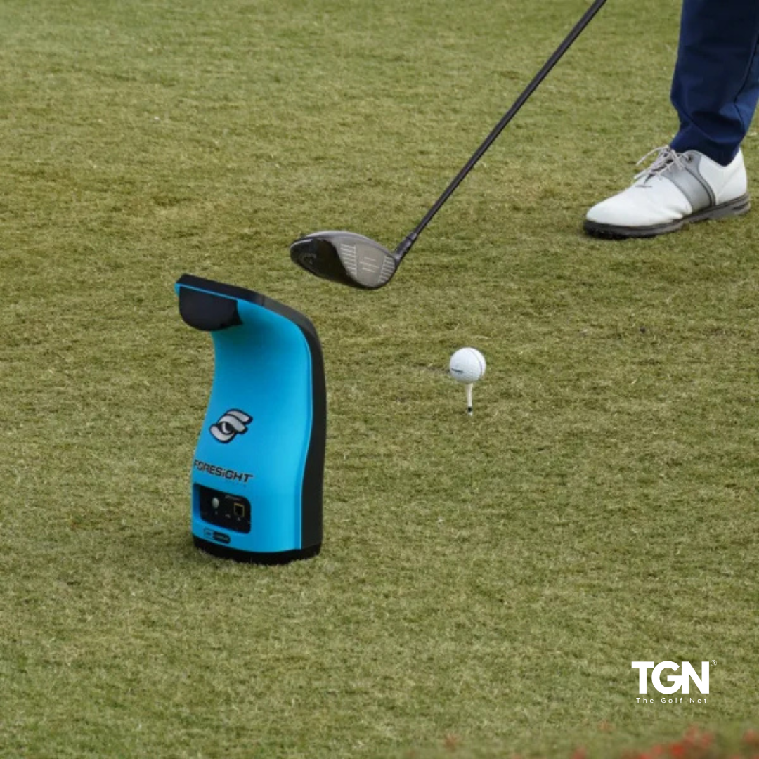 Launch monitor set up on turf mat